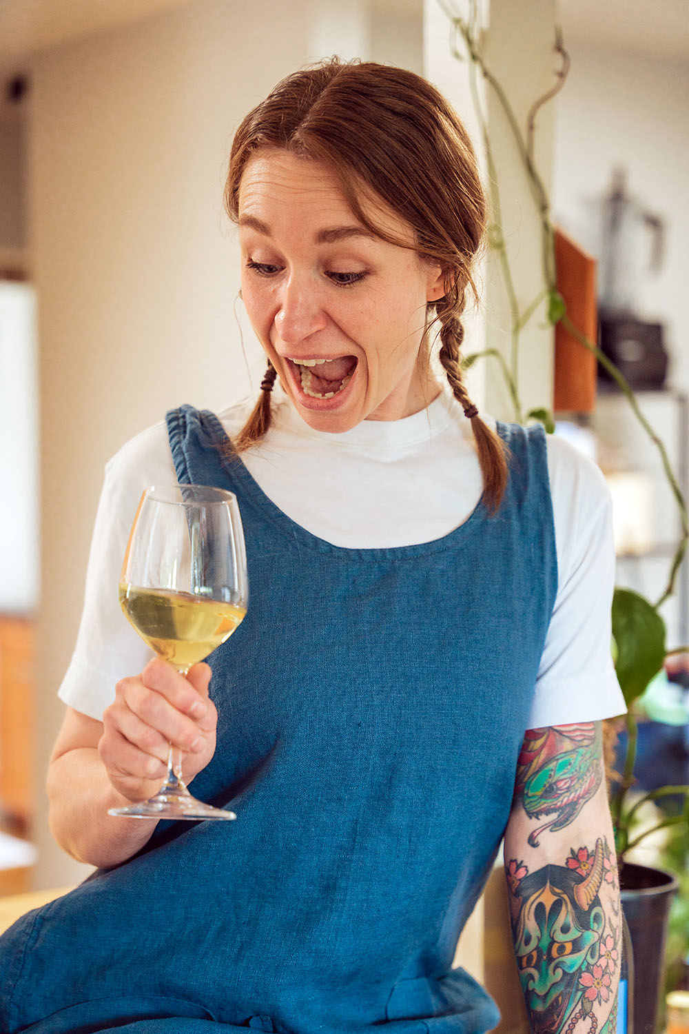 Top Chef contestant Sara Hauman drinking a glass of Massican white wine.