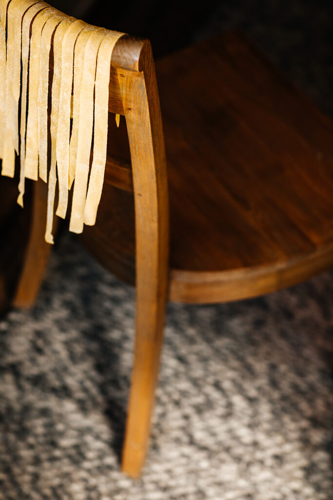 Homemade pasta on the back of a chair. Photo by Emma K. Morris.
