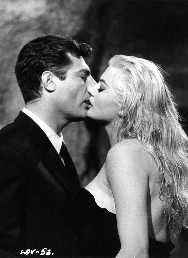 Marcello Mastroianni and Anita Ekberg kissing in the Trevi Fountain in Rome, during Federico Fellini's Masterpiece, La Dolce Vita, a Cannes' Palm d'Or winner in 1961.