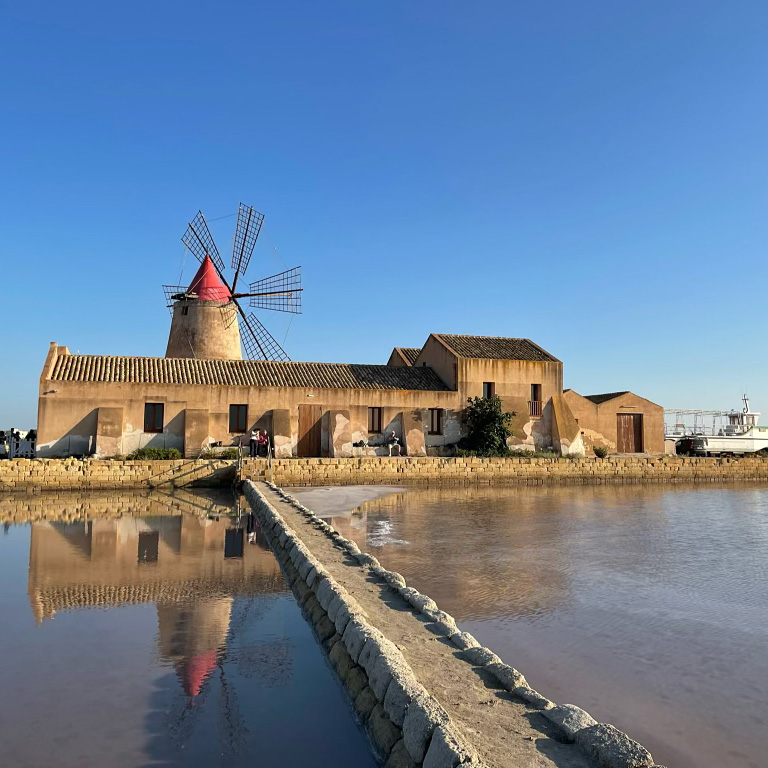 Salt mine in Trapani Sicily. The famous wind mill.